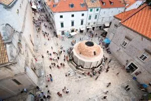 Stand within ancient city walls in Dubrovnik square